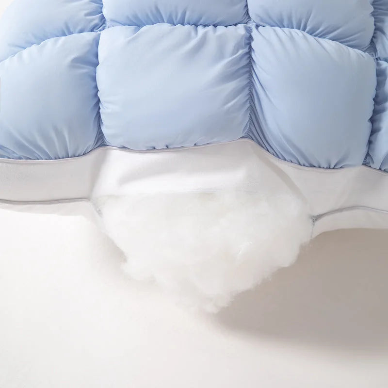 The fluffy white fibre fill inside a Baby Blue Puff Pillow