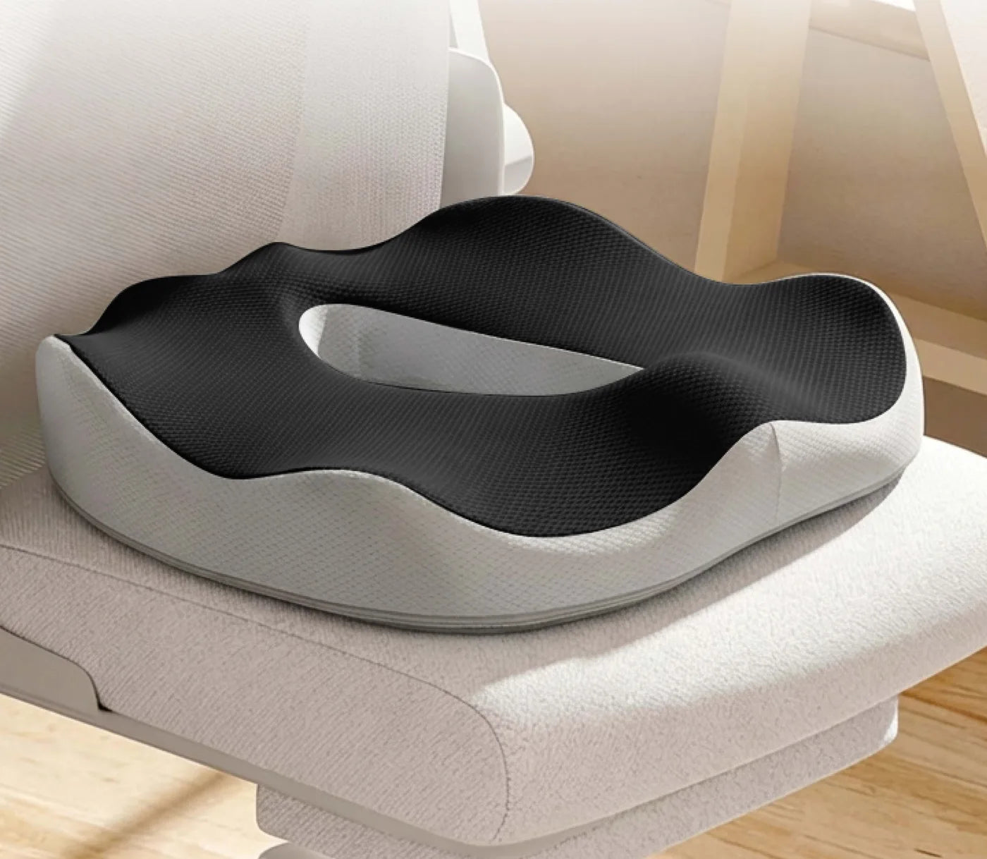 The ComfoVa 4-wing seat cushion on an office chair